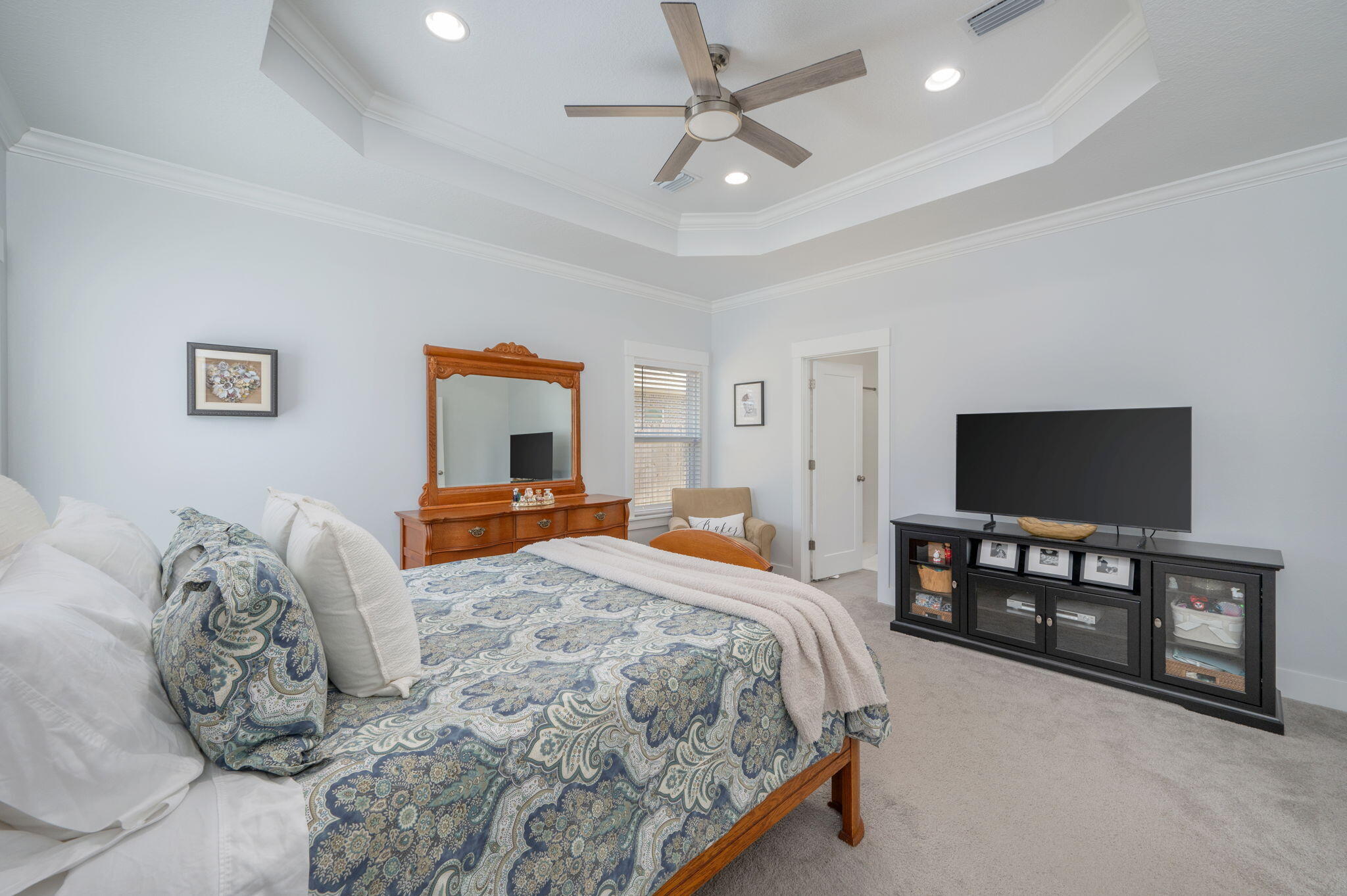 8 Maple Avenue Shalimar, FL 32579 - Photo 27 of 71 a bedroom with a bed and a flat screen tv