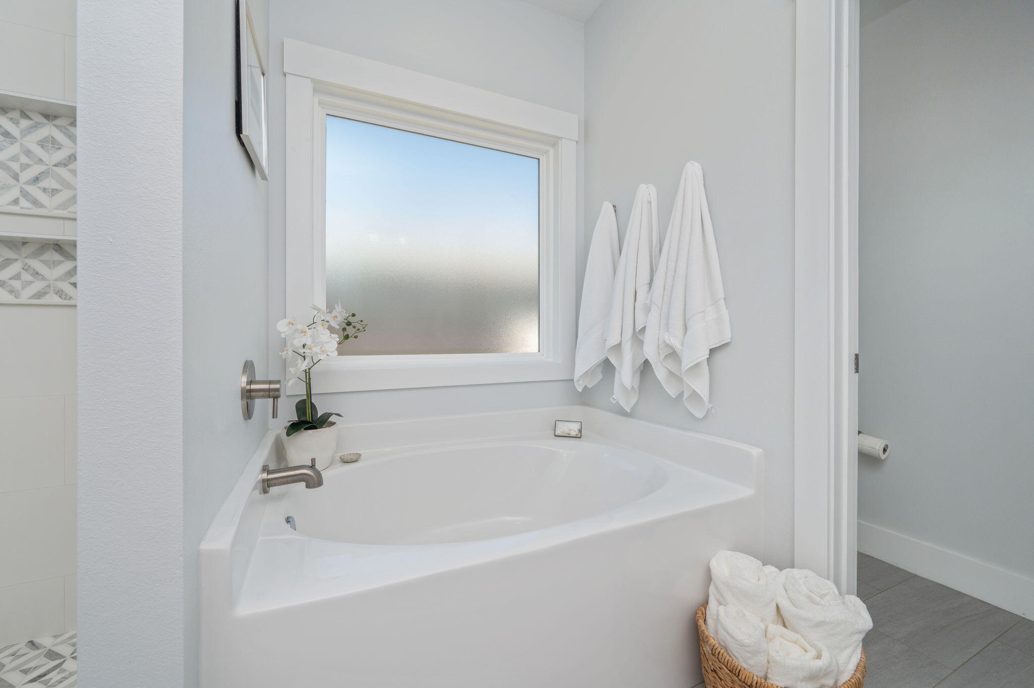 8 Maple Avenue Shalimar, FL 32579 - Photo 32 of 71 a white bath tub sitting next to a white sink and vanity