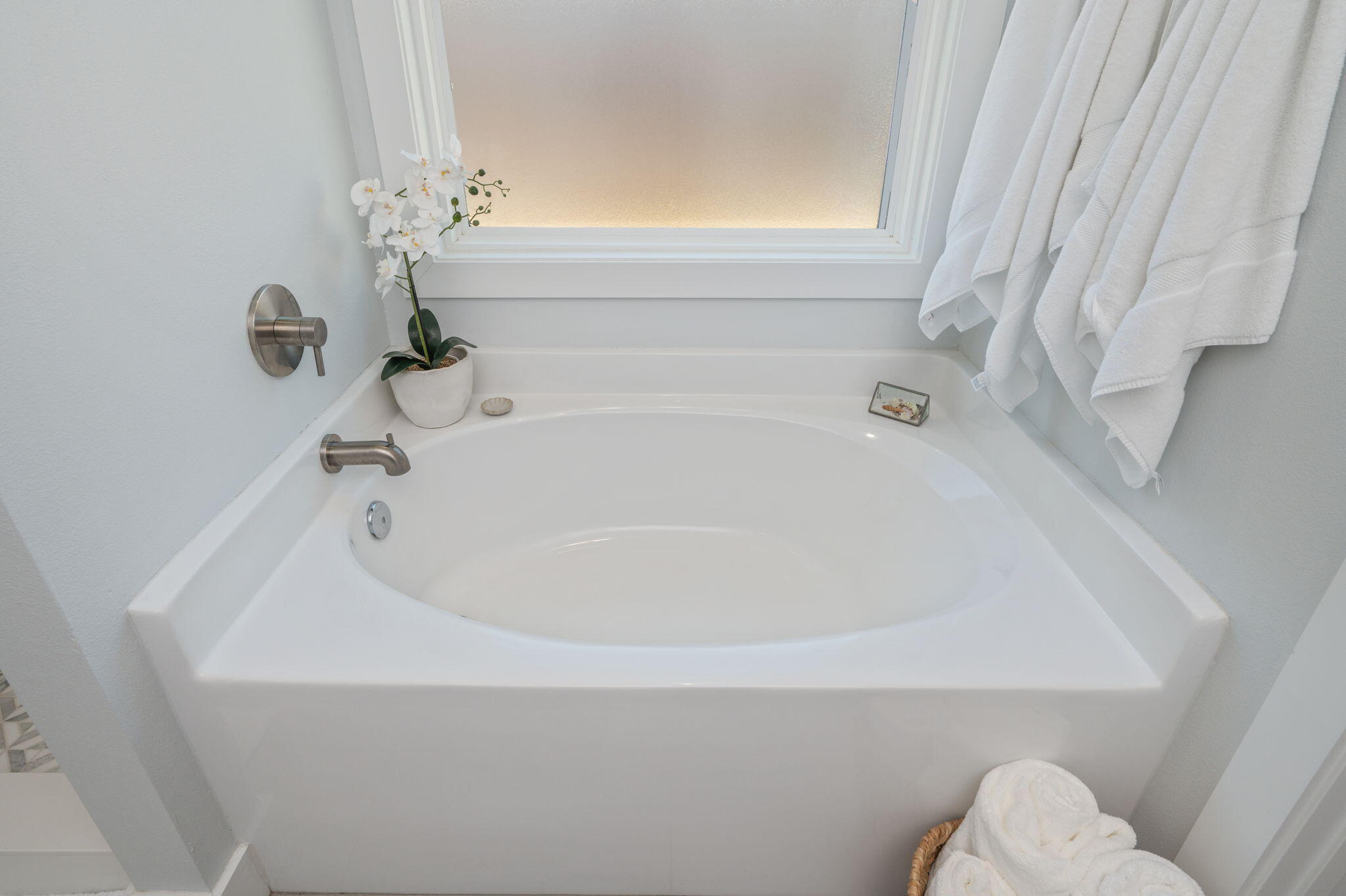8 Maple Avenue Shalimar, FL 32579 - Photo 33 of 71 a bathroom with a white bath tub and a window