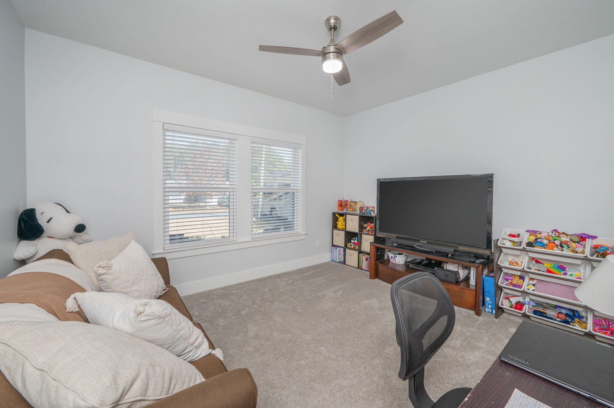 8 Maple Avenue Shalimar, FL 32579 - Photo 41 of 71 a bedroom with furniture and a flat screen tv