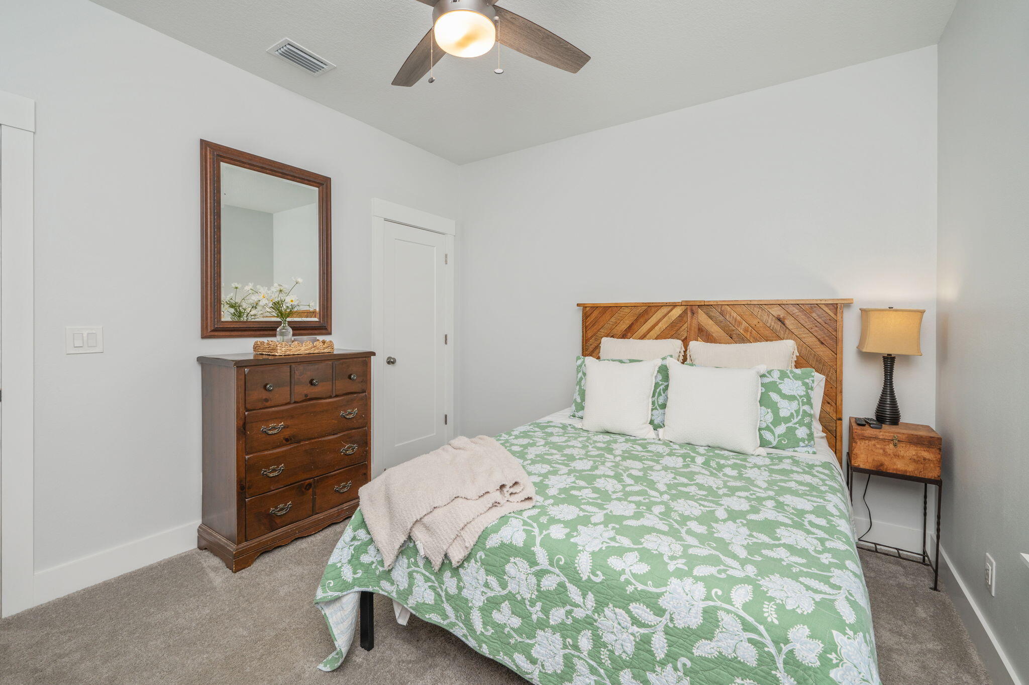 8 Maple Avenue Shalimar, FL 32579 - Photo 44 of 71 a bedroom with a bed and a dresser