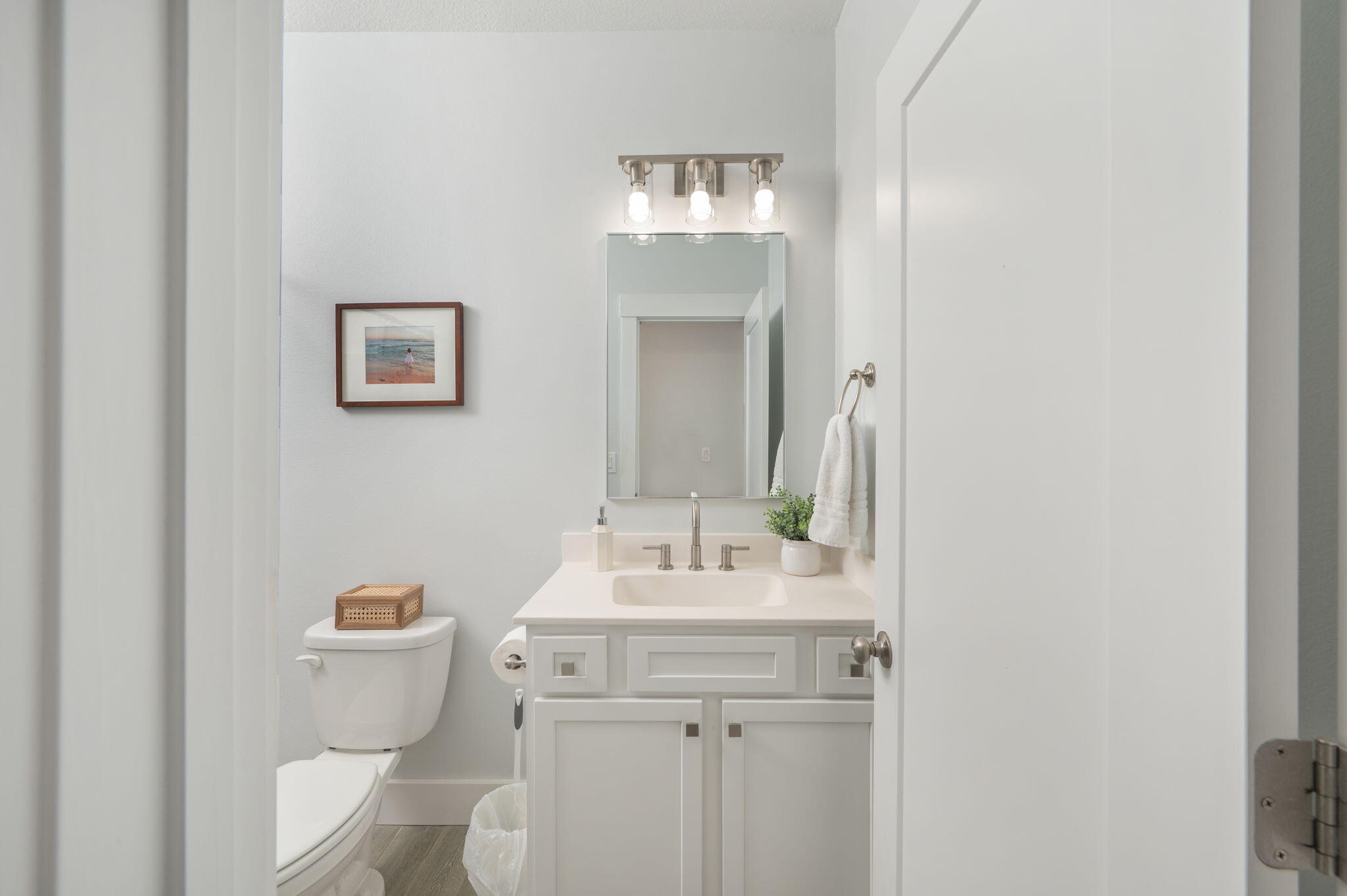 8 Maple Avenue Shalimar, FL 32579 - Photo 48 of 71 a bathroom with a toilet sink and mirror