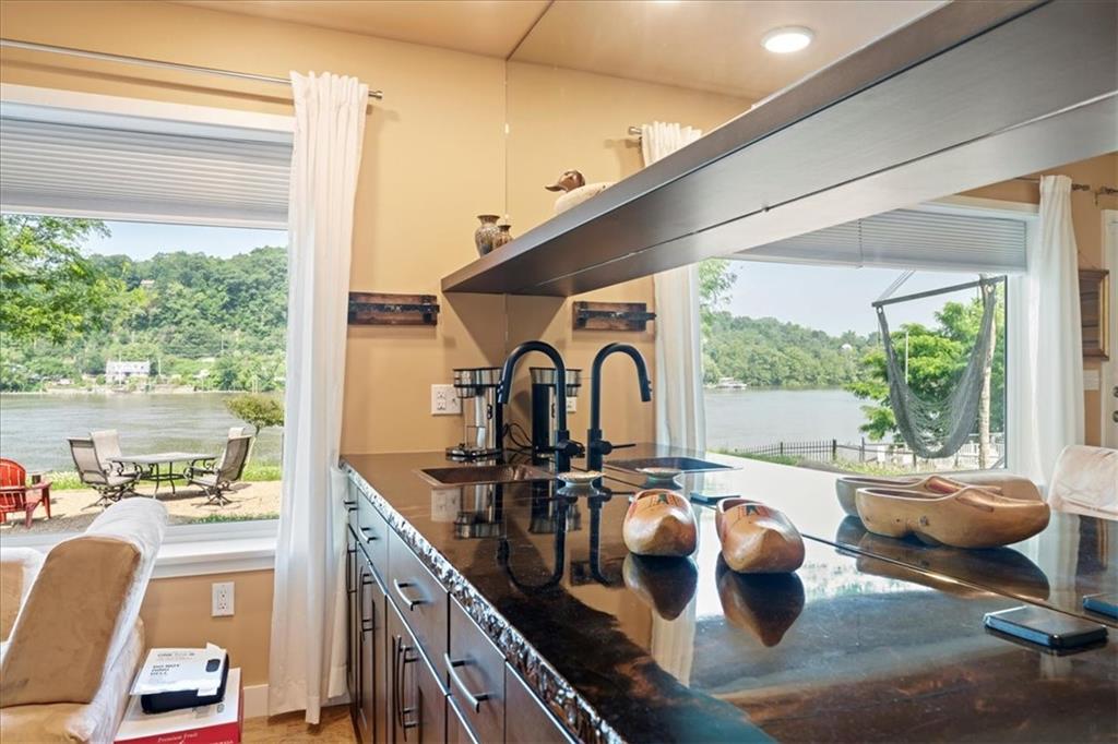 548 Penn Street Verona, PA 15147 - Photo 14 of 47 a very nice looking living room with a large window and dining table