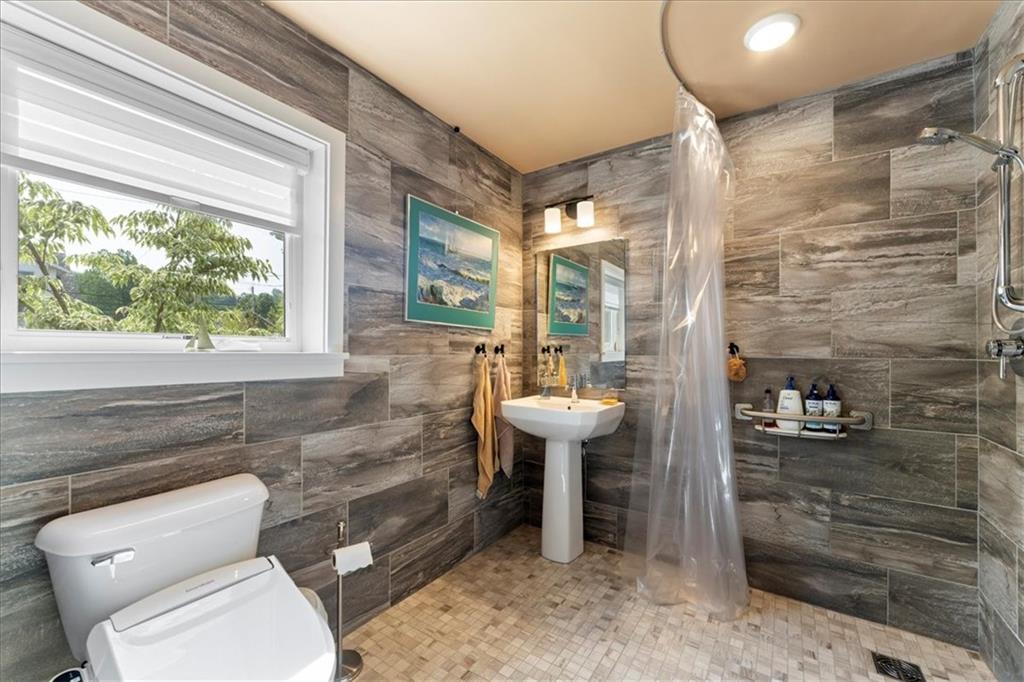 548 Penn Street Verona, PA 15147 - Photo 17 of 47 a bathroom with a sink toilet and shower