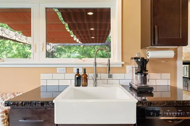 a bathroom with a sink and a window