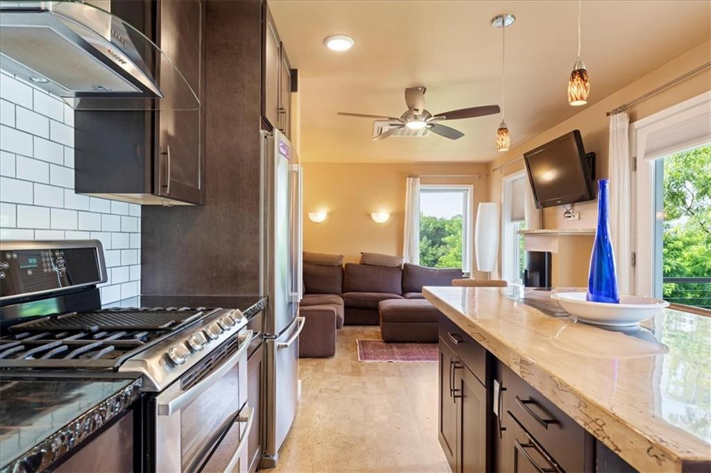 548 Penn Street Verona, PA 15147 - Photo 27 of 47 a kitchen with furniture a stove and a sink