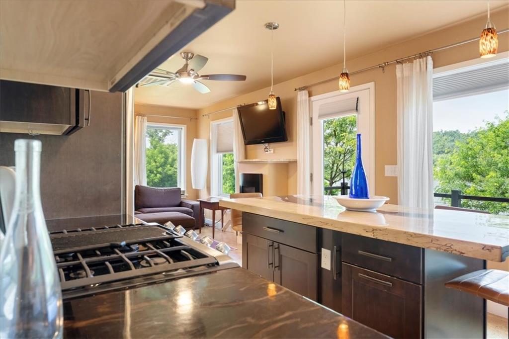 548 Penn Street Verona, PA 15147 - Photo 29 of 47 a kitchen with a stove a sink and a window