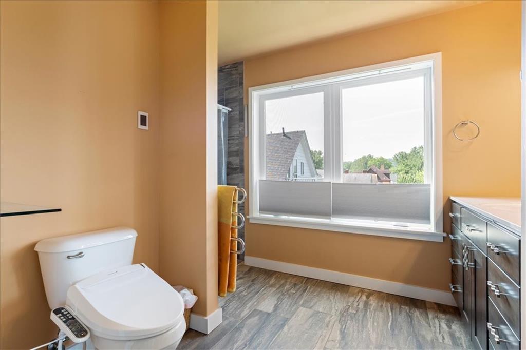 548 Penn Street Verona, PA 15147 - Photo 32 of 47 a bathroom with a toilet and a bath tub