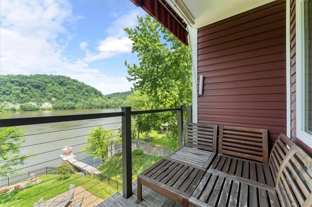 a view of a balcony with wooden floor