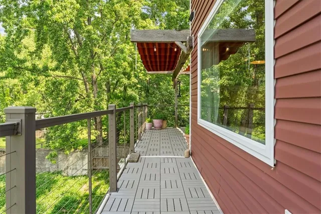 a view of balcony with wooden floor