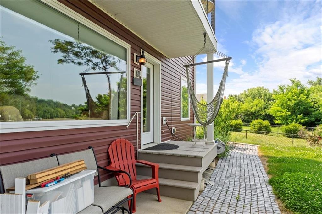 548 Penn Street Verona, PA 15147 - Photo 39 of 47 a view of a patio with table and chairs with wooden floor and fence