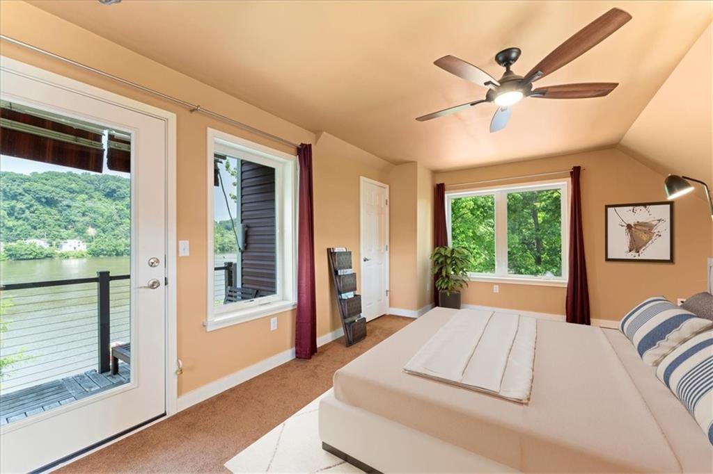 548 Penn Street Verona, PA 15147 - Photo 44 of 47 a bed sitting in a bedroom next to a window