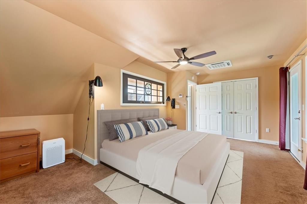 548 Penn Street Verona, PA 15147 - Photo 46 of 47 a bedroom with a large bed and a ceiling fan