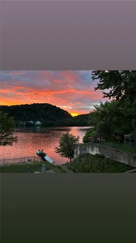 a sunset view with lake view