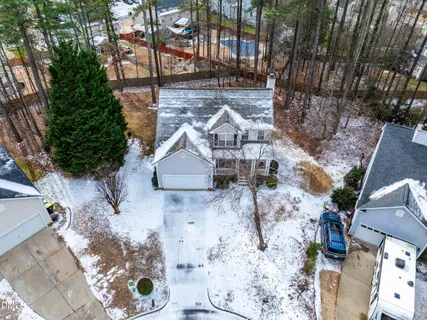 a view of a yard with large trees
