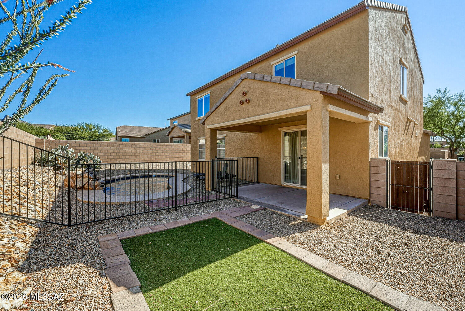 323 East Refuge Loop Vail, AZ 85641 - Photo 43 of 51 a view of a house with a small yard and wooden fence