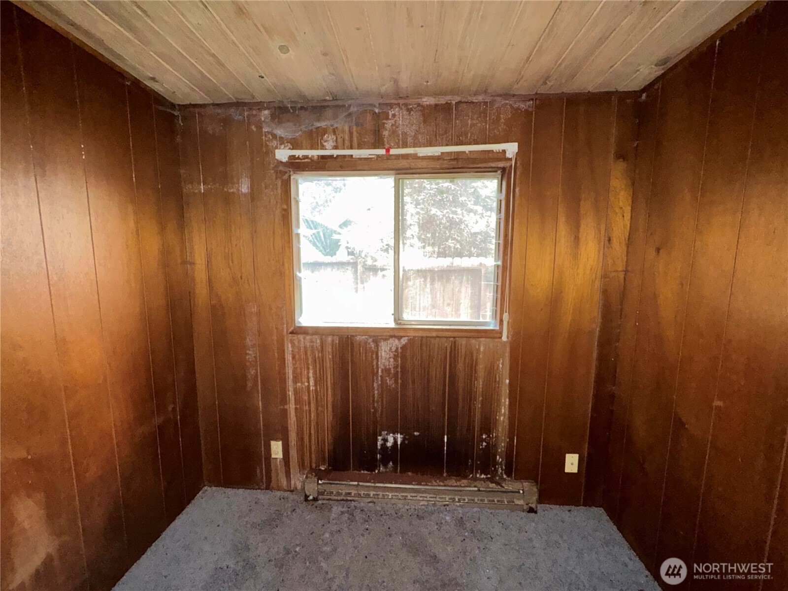 1284 Dines Point Road Greenbank, WA 98253 - Photo 17 of 39 an empty room with windows chandelier fan and windows