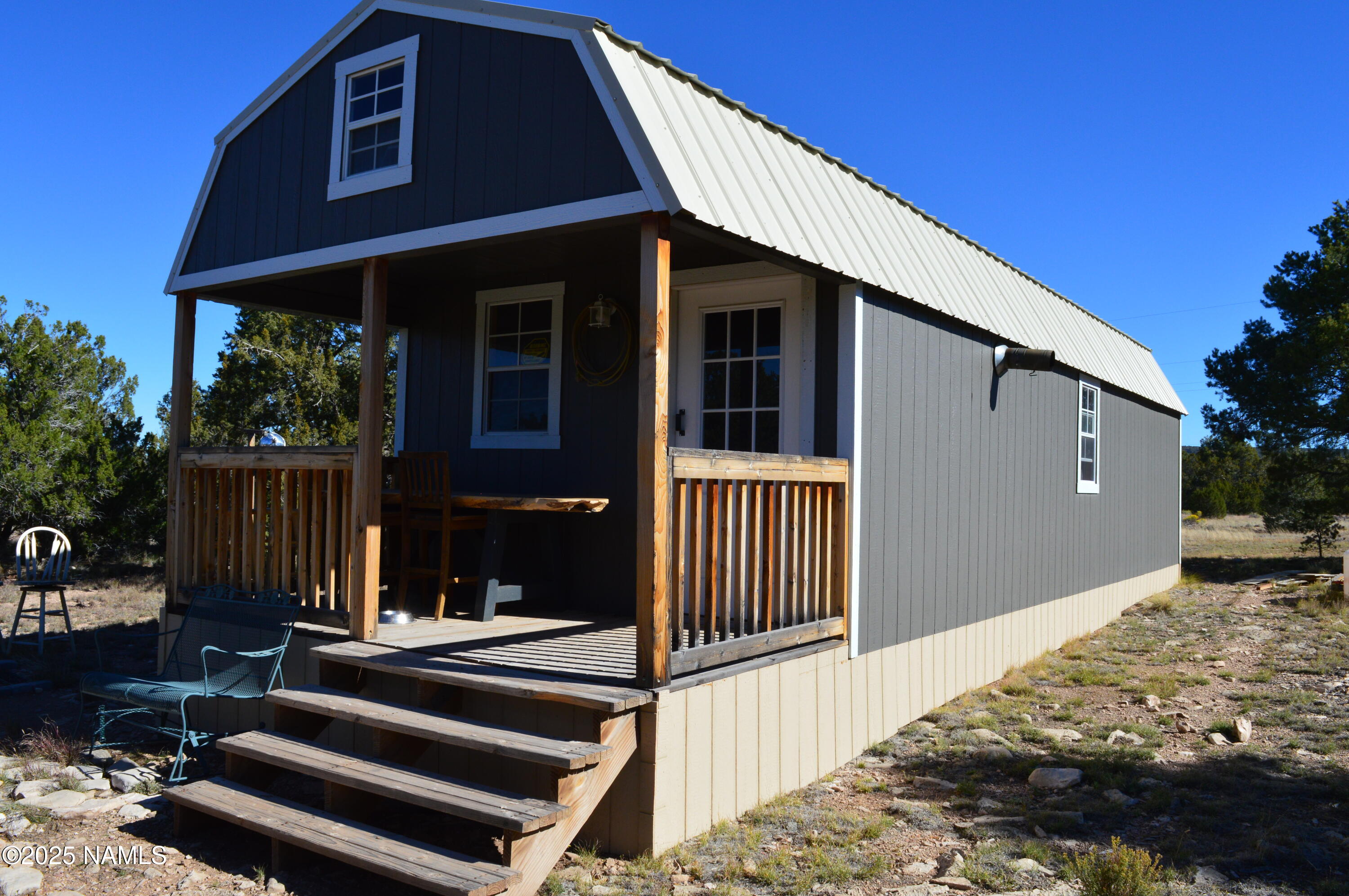 13887 Bly Station Road Williams, AZ 86046 - Photo 17 of 22 a view of a house with a balcony