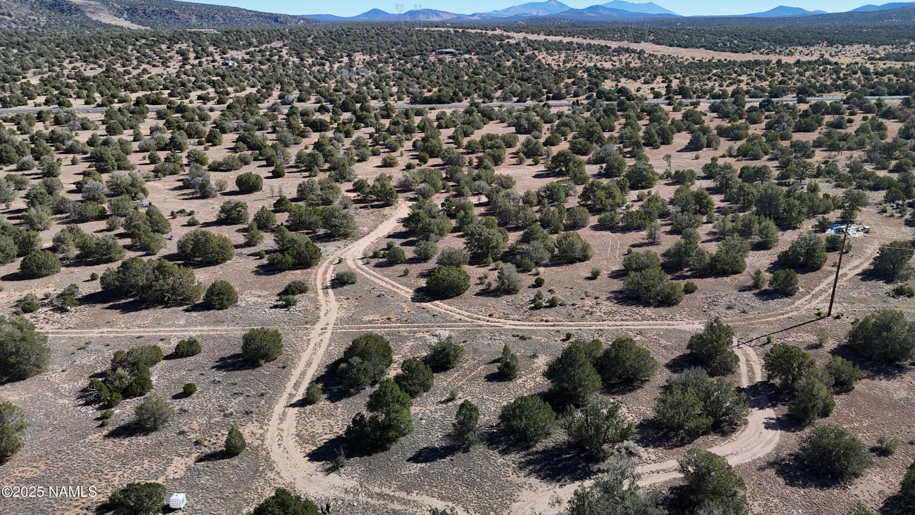 13887 Bly Station Road Williams, AZ 86046 - Photo 3 of 22 a view of a city with mountain