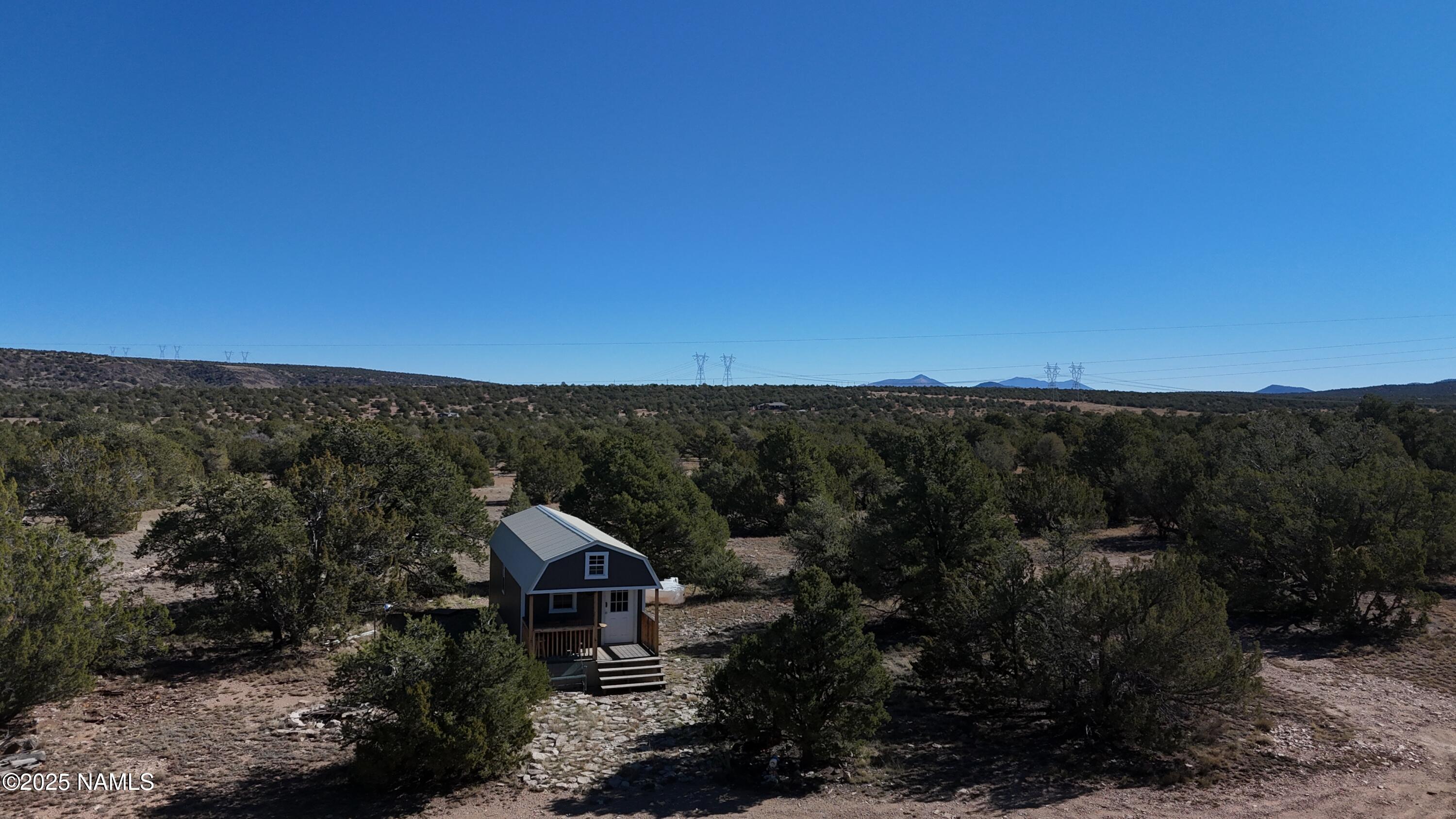 13887 Bly Station Road Williams, AZ 86046 - Photo 4 of 22 a view of house with outdoor space