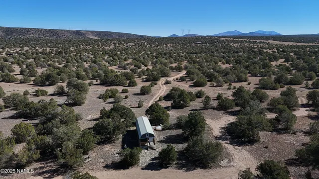 an aerial view of house with yard