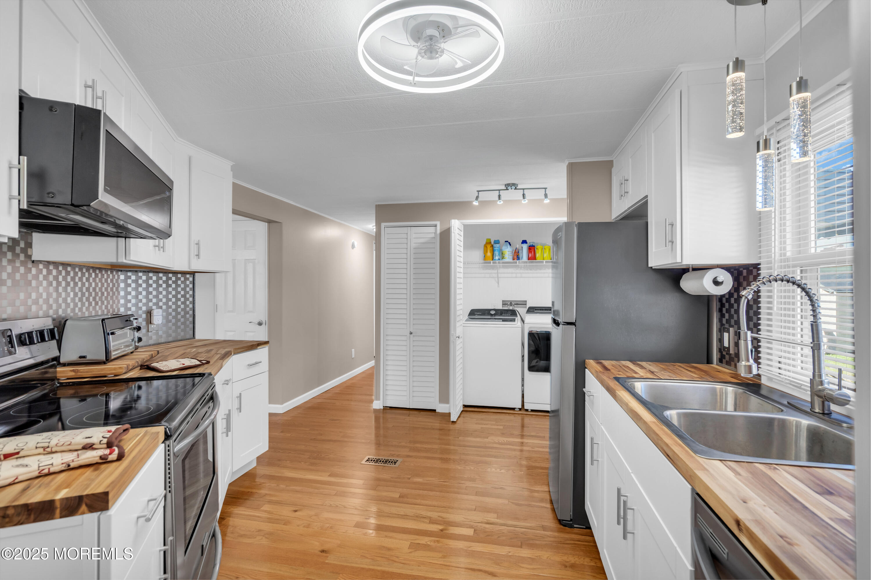 166 Mockingbird Way Whiting, NJ 08759 - Photo 16 of 28 a kitchen with stainless steel appliances granite countertop a sink stove and refrigerator