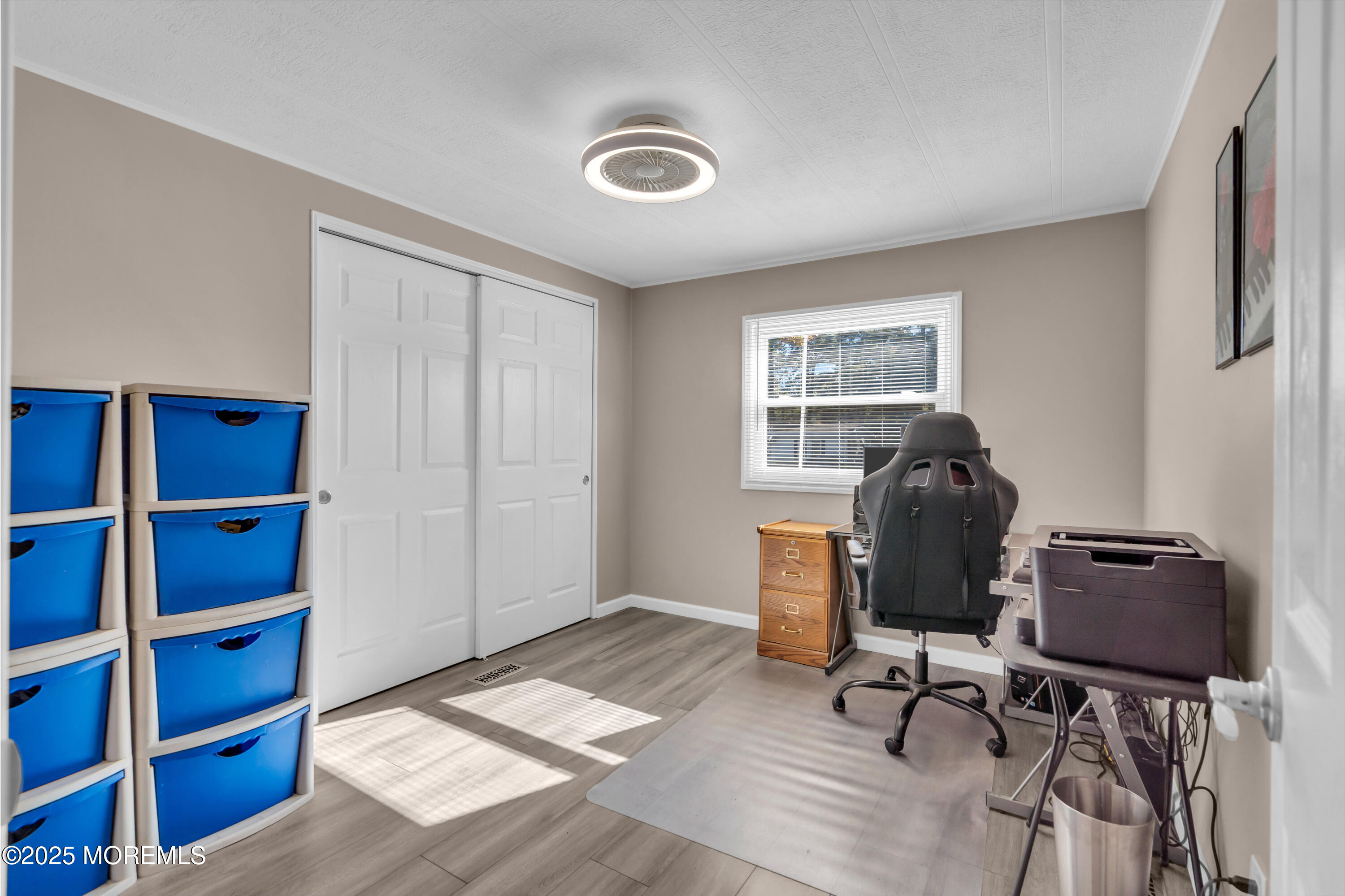 166 Mockingbird Way Whiting, NJ 08759 - Photo 21 of 28 a view of workspace with wooden floor lounge chair and windows
