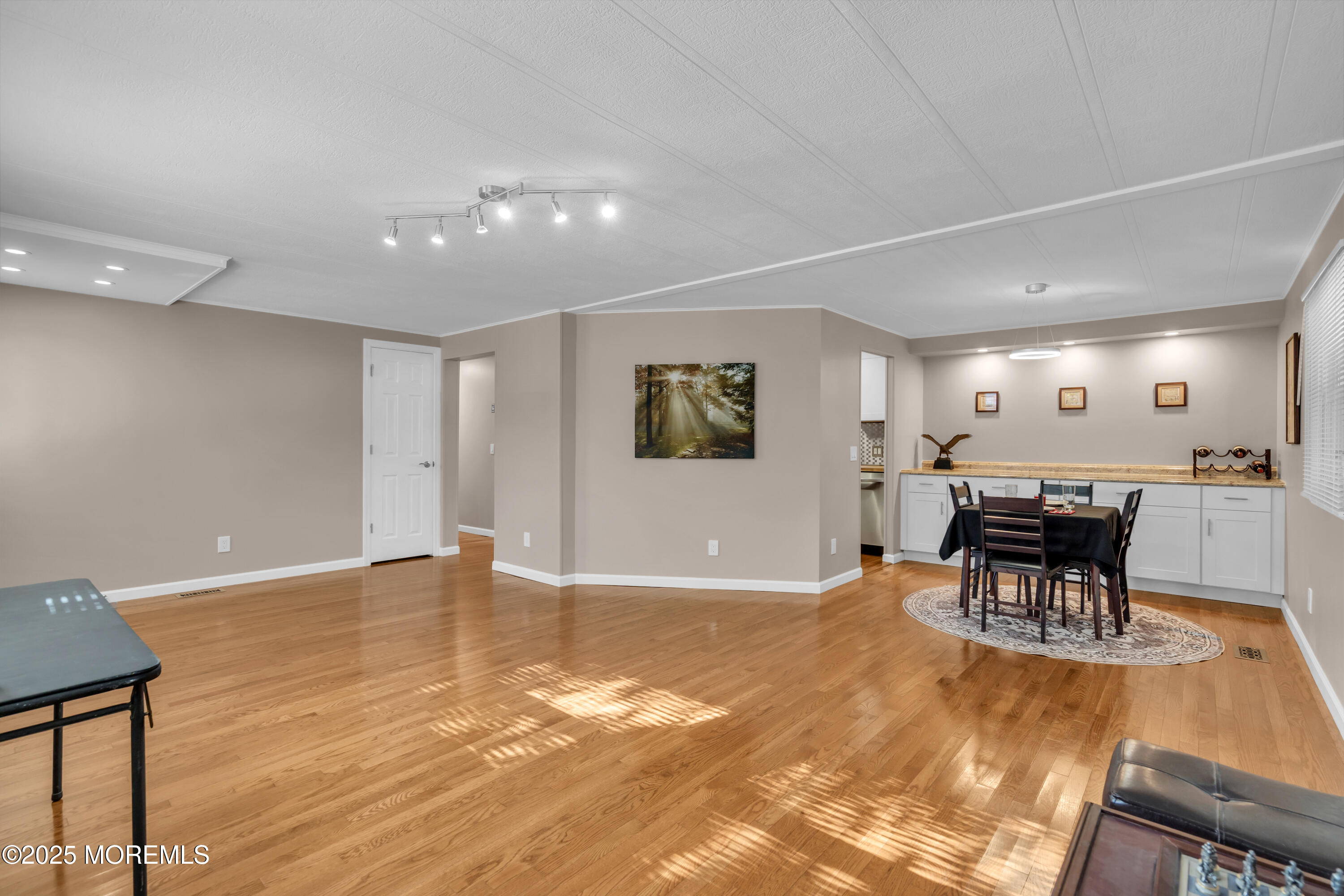 166 Mockingbird Way Whiting, NJ 08759 - Photo 8 of 28 a view of a big room with dining room wooden floor and a rug