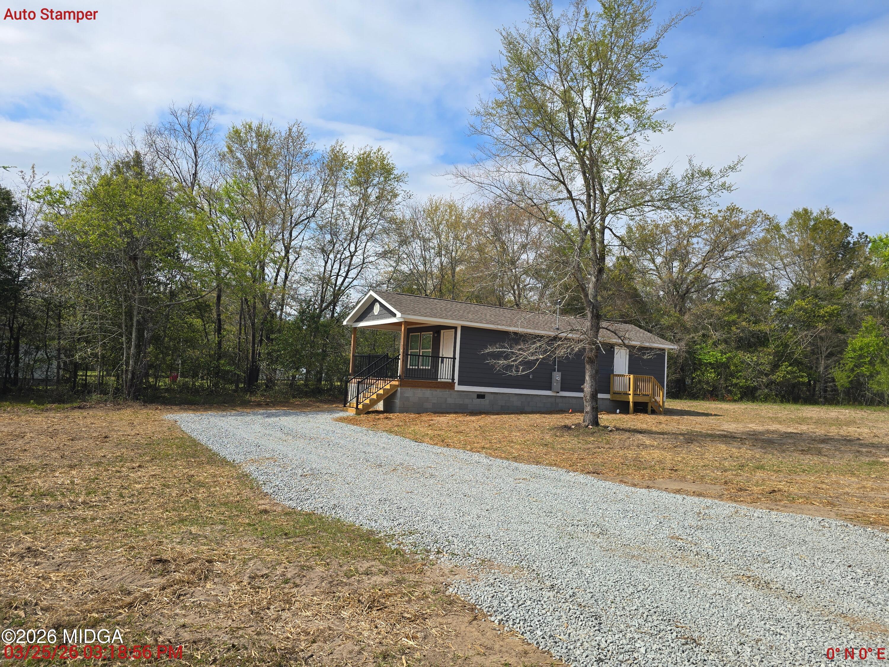3896 Davis Road Macon, GA 31217 - Photo 11 of 12 a view of a house with backyard and trees