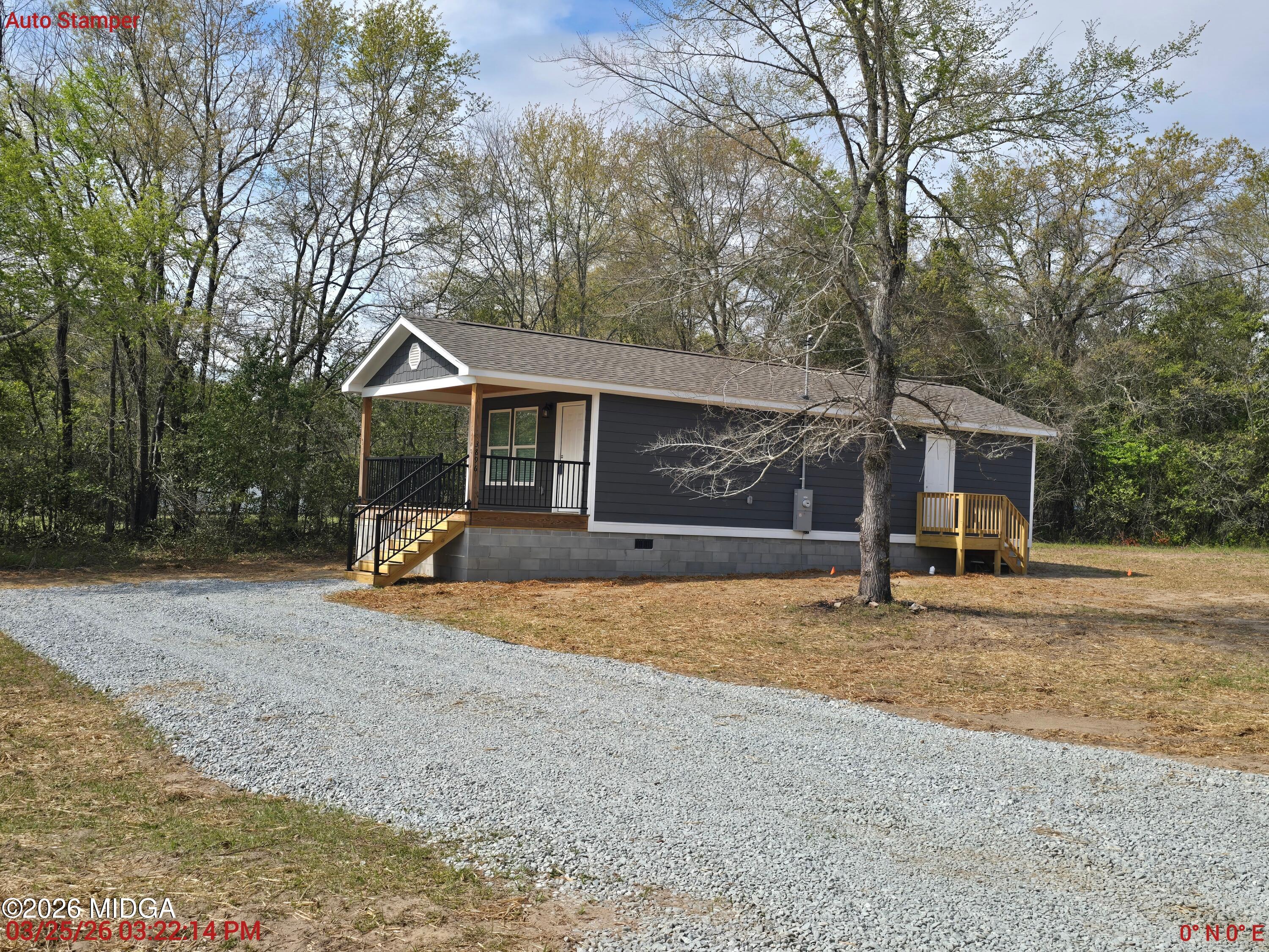 3896 Davis Road Macon, GA 31217 - Photo 12 of 12 a view of a house with a yard and large tree