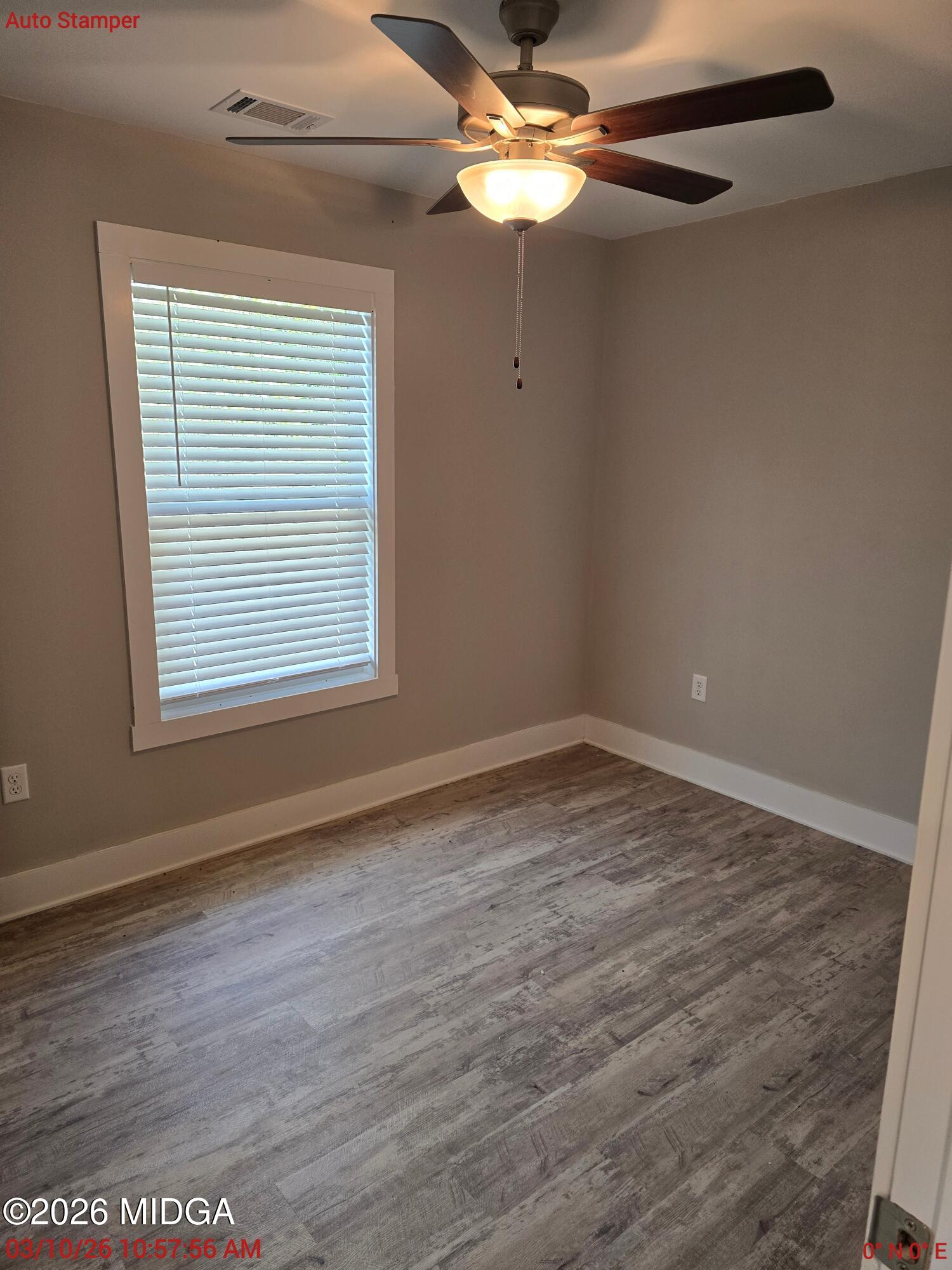 3896 Davis Road Macon, GA 31217 - Photo 8 of 12 a view of empty room with wooden floor and fan