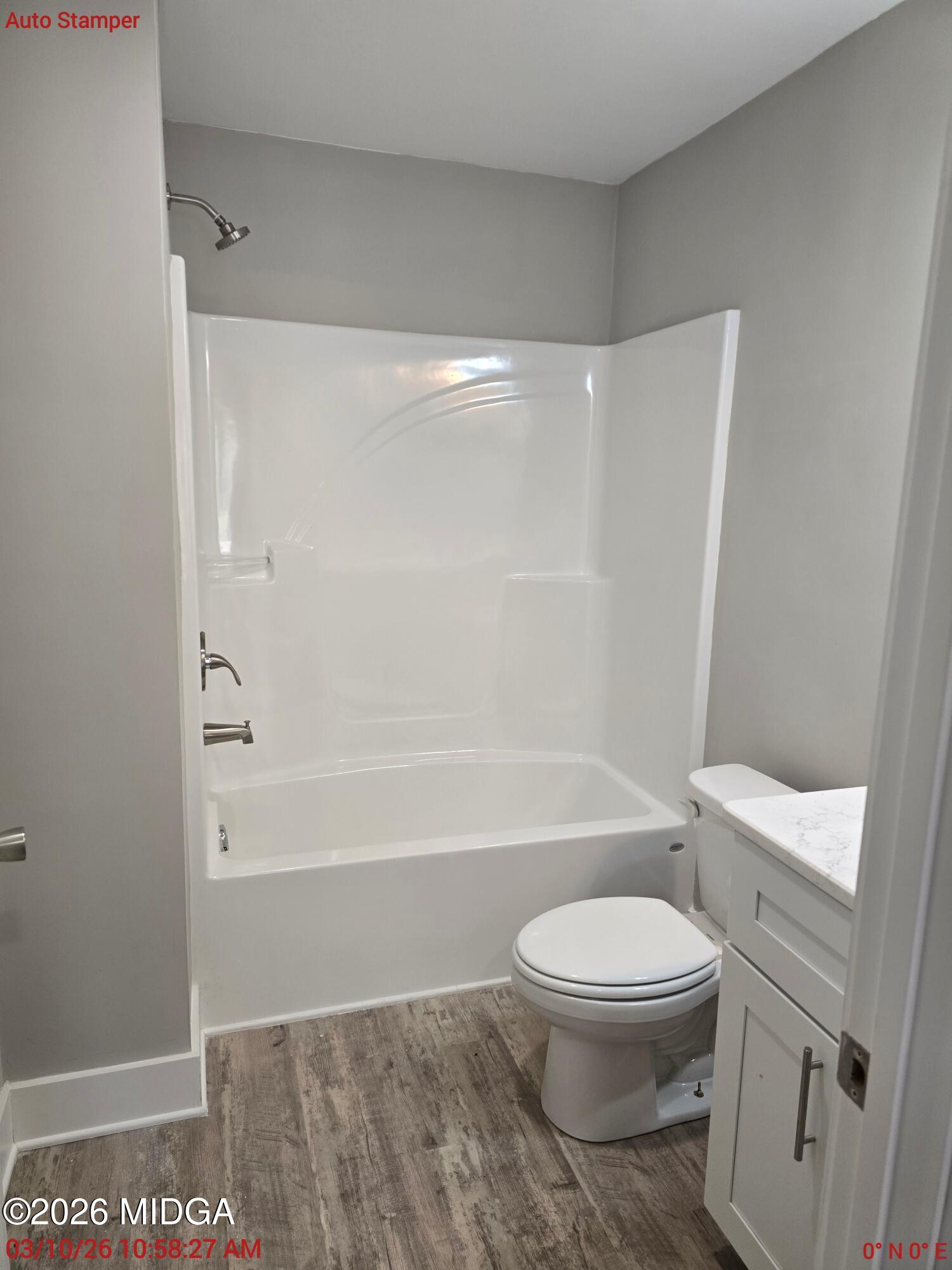 3896 Davis Road Macon, GA 31217 - Photo 9 of 12 a white toilet sitting next to a bath tub