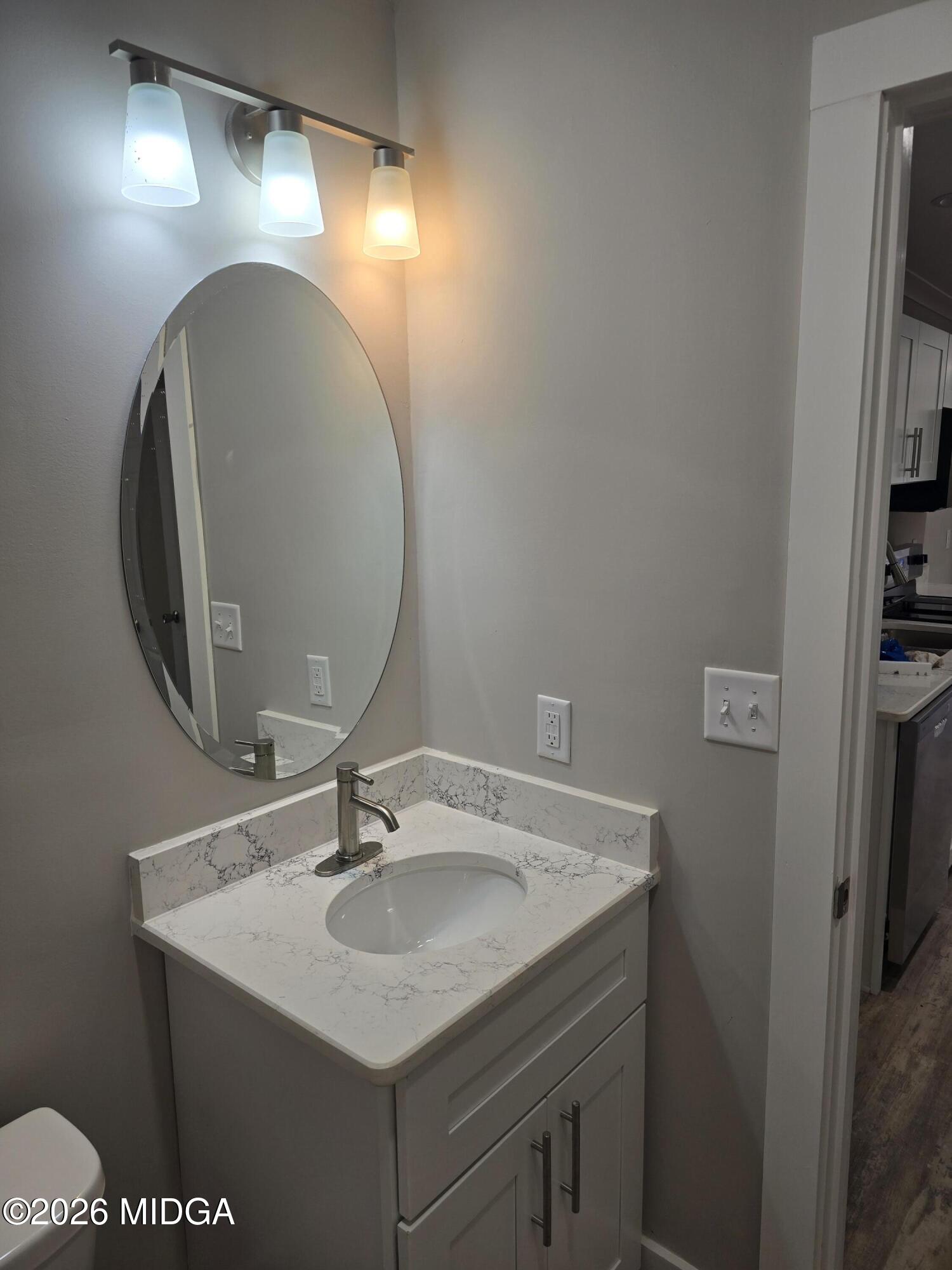 3896 Davis Road Macon, GA 31217 - Photo 10 of 12 a bathroom with a sink and a mirror