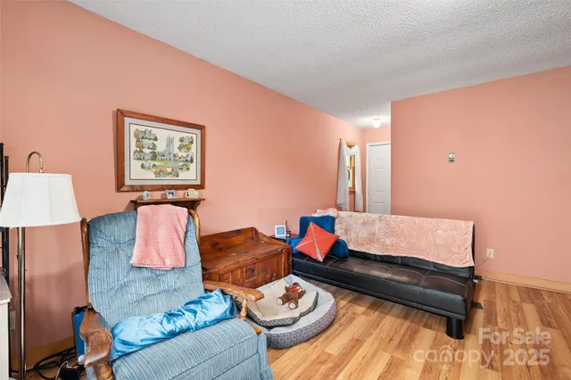a living room with furniture and a lamp