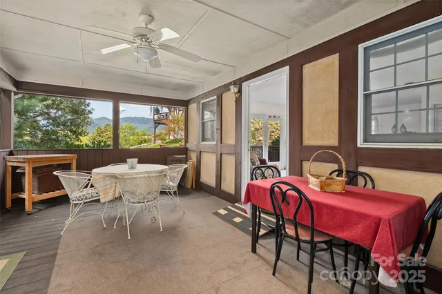 a view of a dining room with furniture window and outside view