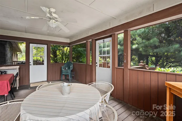 a bed room with a bed and large window