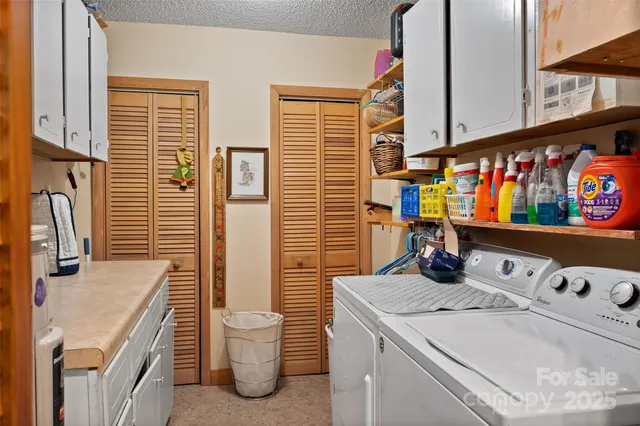 a bathroom with a sink a toilet and a shower