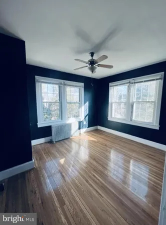a view of a living room with wooden floor