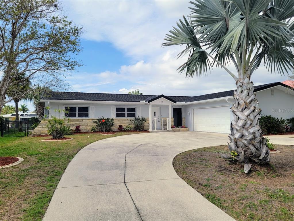 1732 Boca Raton Court Punta Gorda, FL 33950 - Photo 63 of 64 a front view of a house with garden