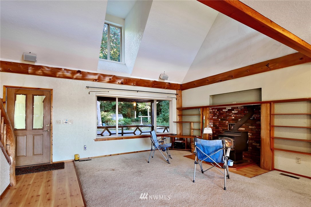 2587 Birch Bay Lynden Road Custer, WA 98240 - Photo 13 of 39 a living room with furniture a fireplace and large windows