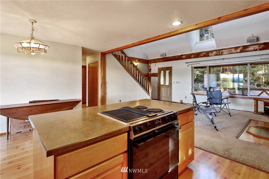 2587 Birch Bay Lynden Road Custer, WA 98240 - Photo 20 of 39 a kitchen with stainless steel appliances granite countertop a stove a chimney and a dining table