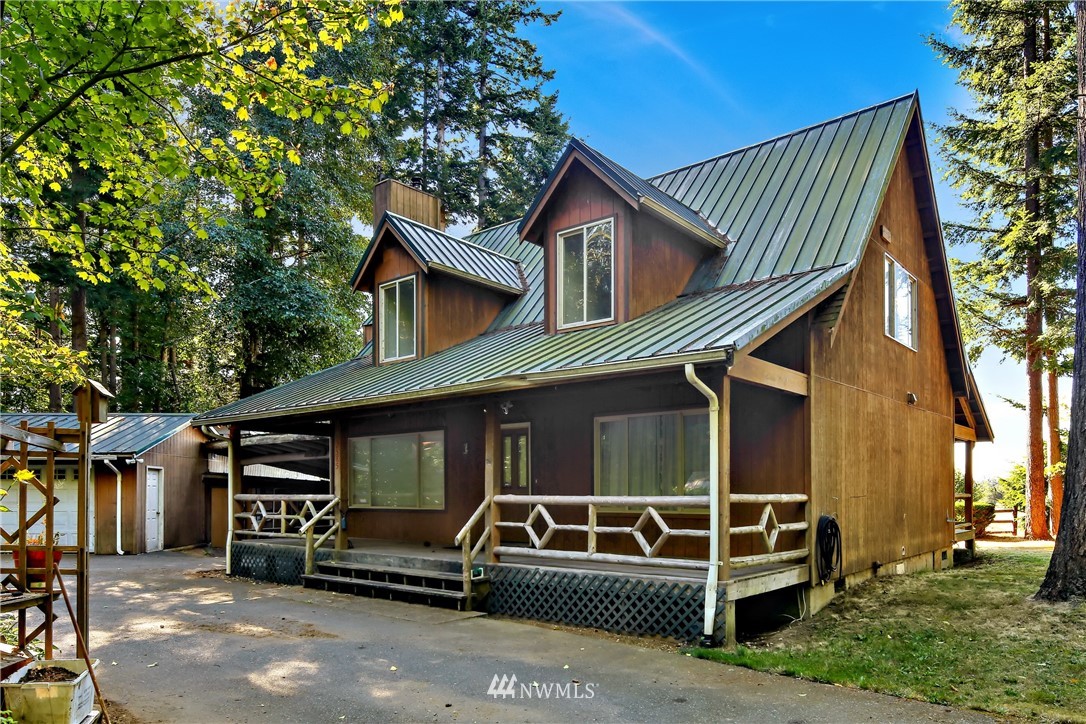 2587 Birch Bay Lynden Road Custer, WA 98240 - Photo 6 of 39 a view of a house with a balcony and wooden fence
