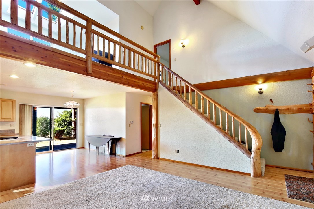 2587 Birch Bay Lynden Road Custer, WA 98240 - Photo 10 of 39 a view of staircase with lots of furniture and wooden floor