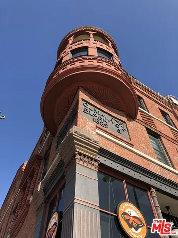 a front view of a building with street view
