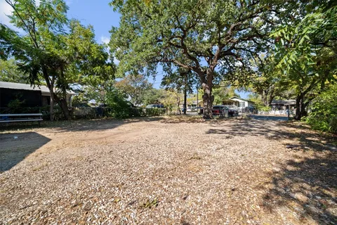 a view of outdoor space with deck and trees