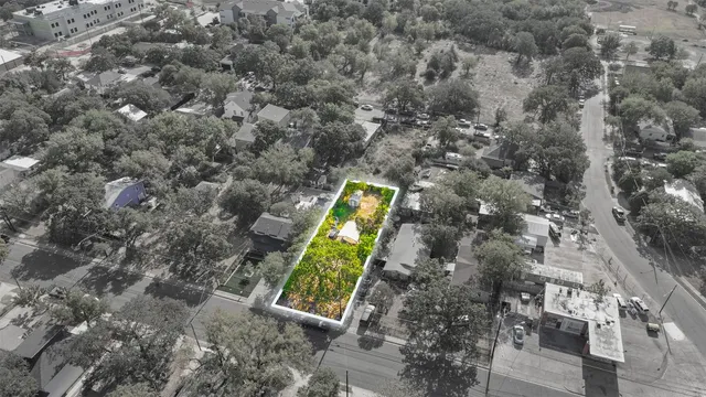 an aerial view of a house with swimming pool