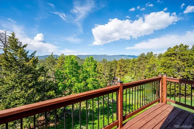 a bathroom with a sink and mirror with bathtub