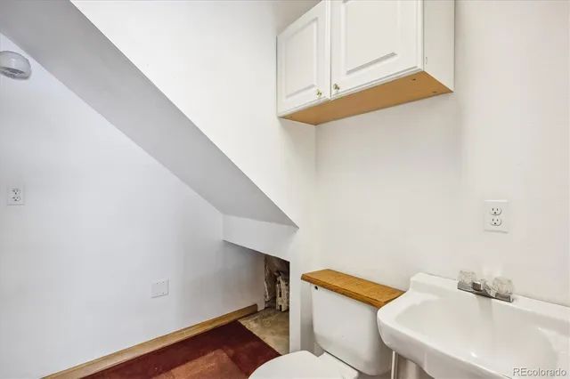 a view of backyard with wooden fence and trees