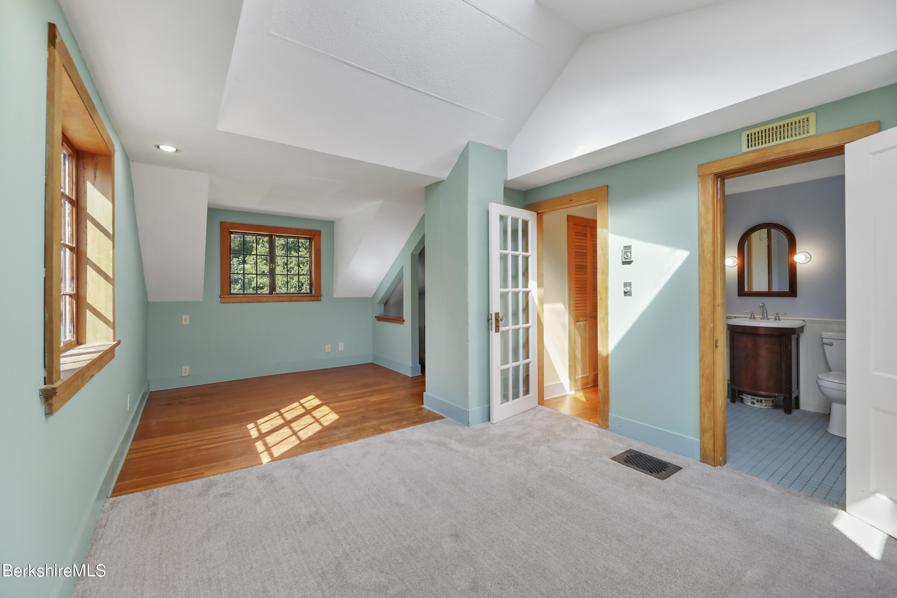 56 Brett Road Monterey, MA 01245 - Photo 12 of 22 a view of an empty room with a fireplace and a window