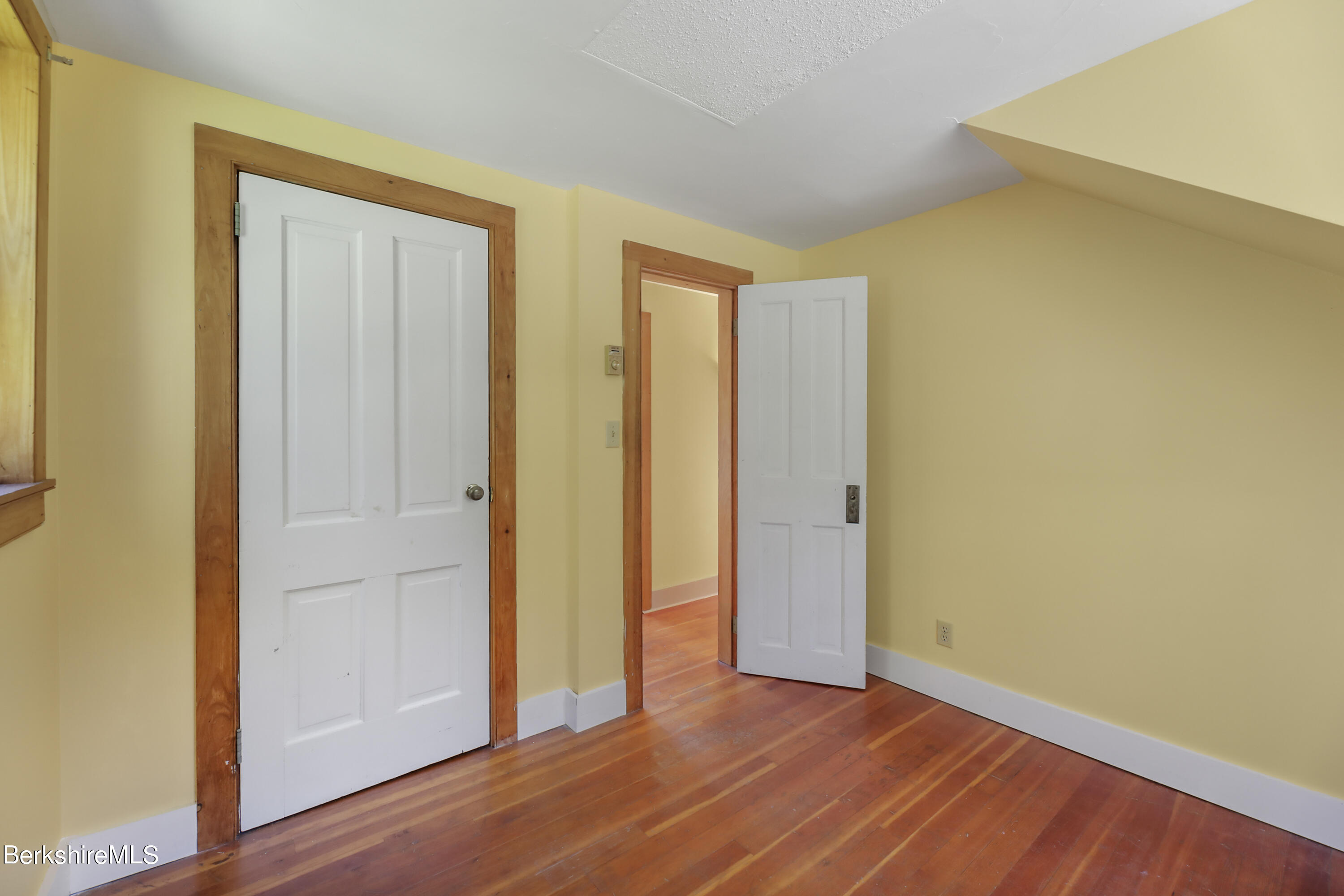 56 Brett Road Monterey, MA 01245 - Photo 16 of 22 a view of an empty room with wooden floor